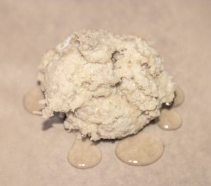 Mixed dough on parchment paper with oil